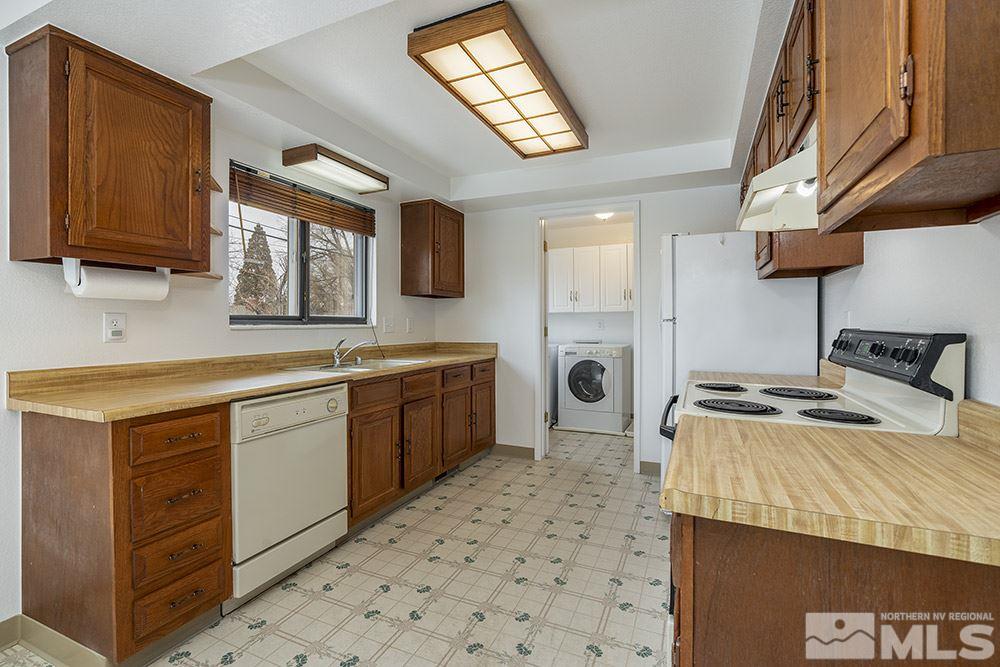2235 Trentham Way Reno, NV 89509 - Photo 6 of 13 a kitchen with a sink appliances and cabinets