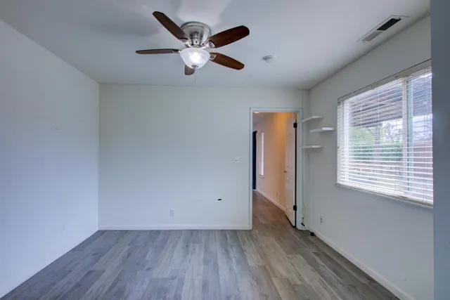 a bathroom with a double vanity sink a toilet and a mirror