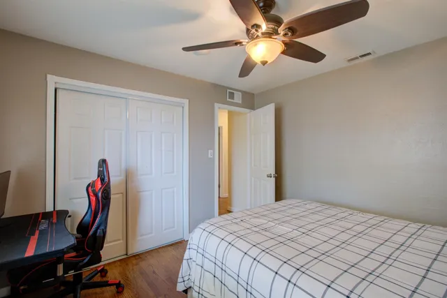 a bedroom with a workspace