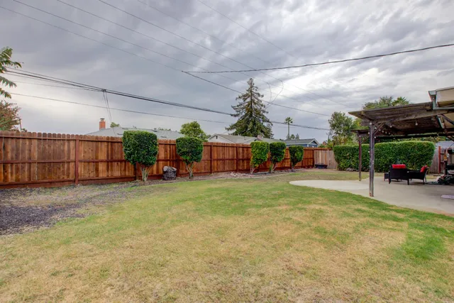 front view of a house with a porch and a yard