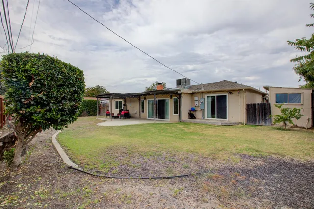 a view of a patio with table and chairs potted plants with wooden floor