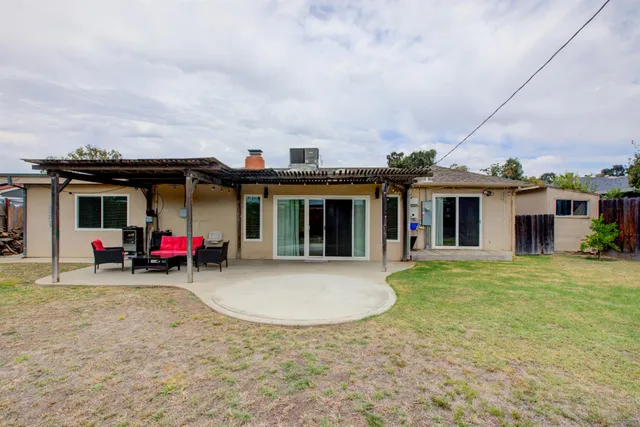 a view of a backyard with sitting area