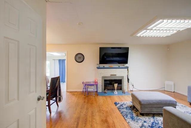 a bedroom with furniture and a fireplace