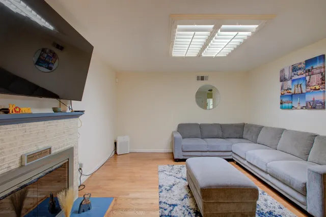 a living room with furniture and a fireplace