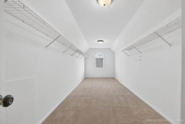 an empty room with a empty space and windows