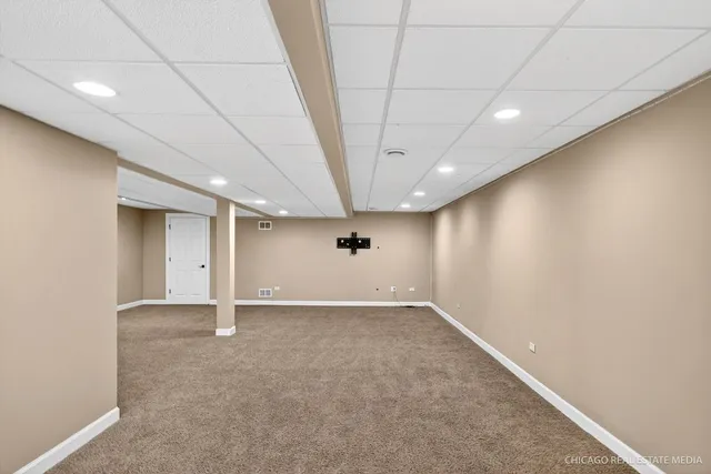 a view of a street with a large trees