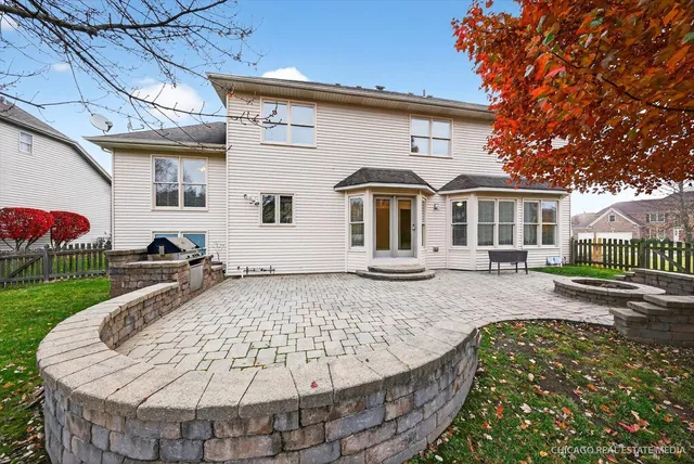 an aerial view of a house with a lake view
