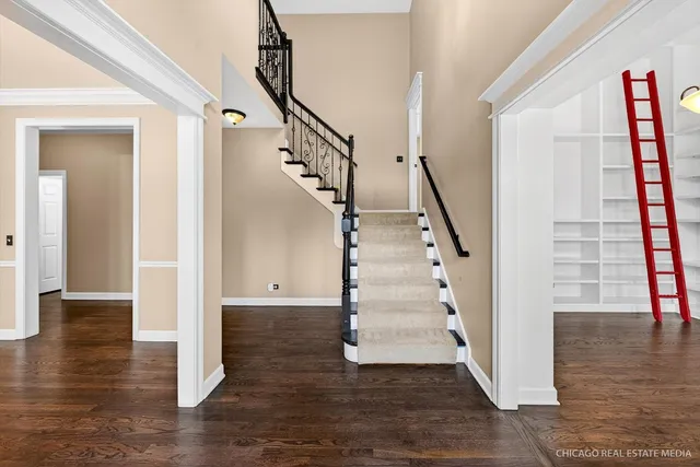 a view of a workspace with furniture and wooden floor