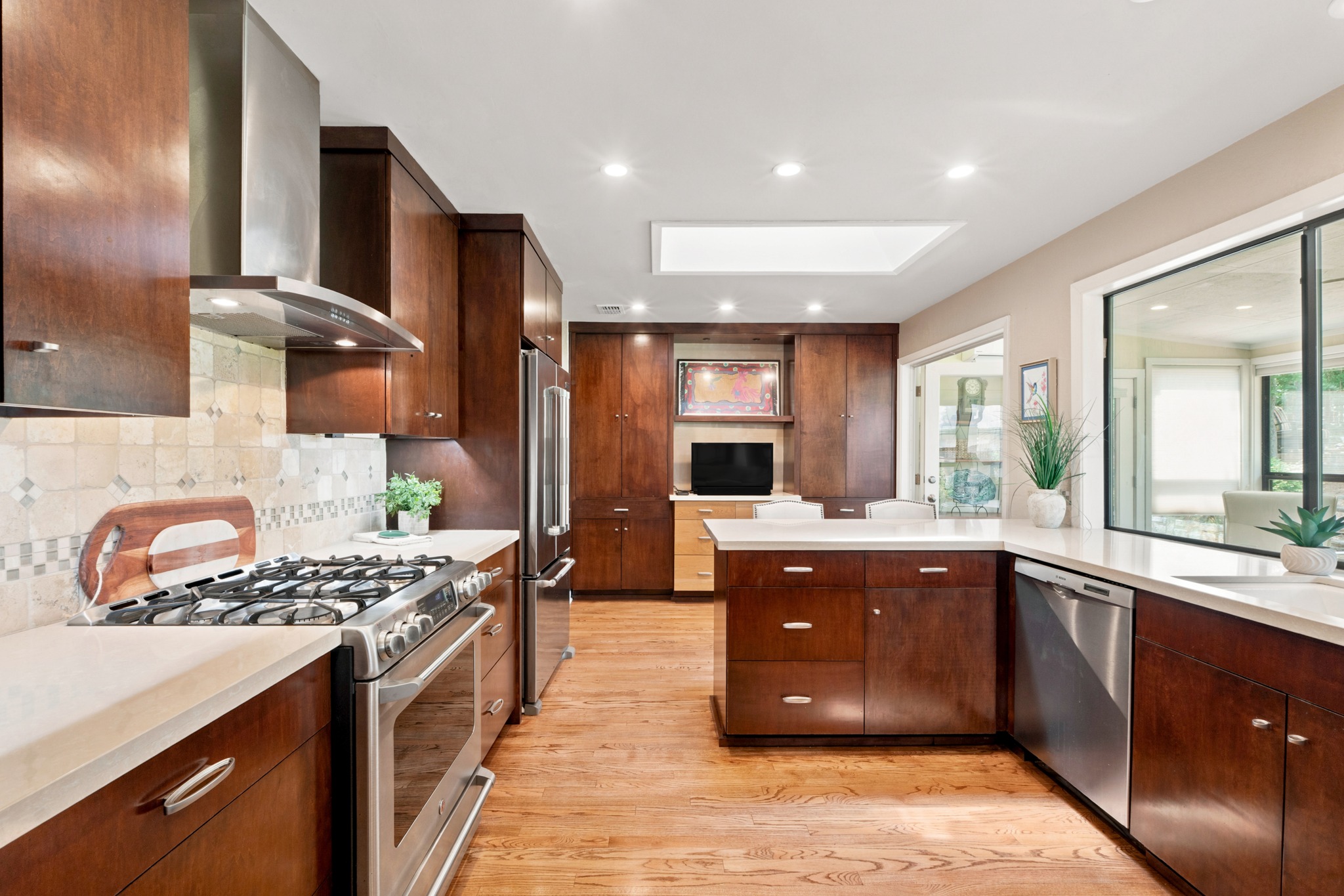 1904 Stoneridge Road Austin, TX 78746 - Photo 15 of 40 Updated kitchen includes ample prep space, stainless appliances and custom cabinetry.