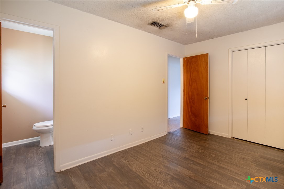 2903 Gayle Street Victoria, TX 77901 - Photo 13 of 21 a view of a room with wooden floor and a ceiling fan
