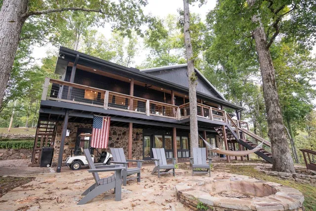 a front view of a house with garden and porch