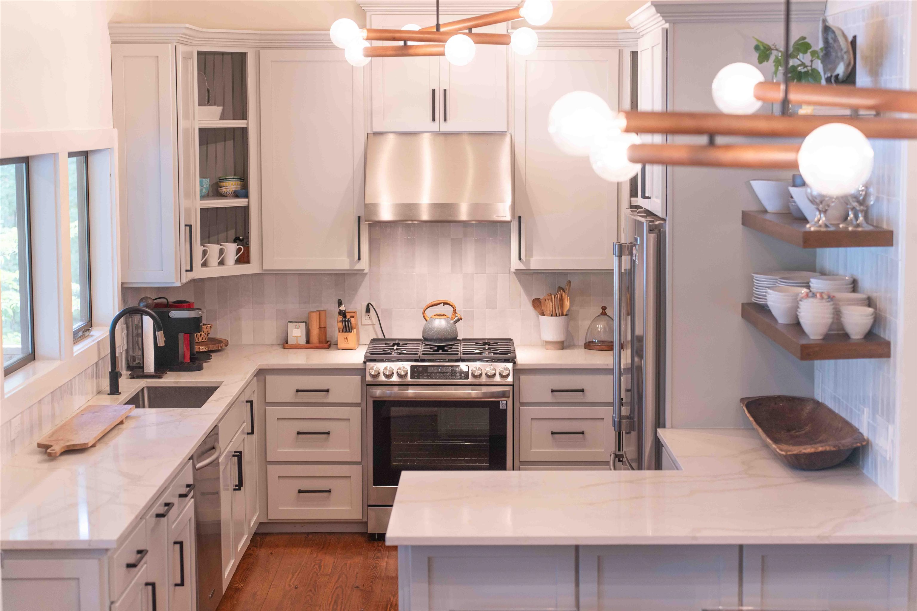 150 Turley Lane Counce, TN 38326 - Photo 10 of 35 a kitchen with stainless steel appliances a stove a sink and cabinets