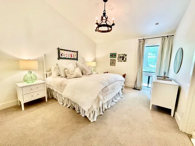 a spacious bathroom with a double vanity sink a mirror and a shower