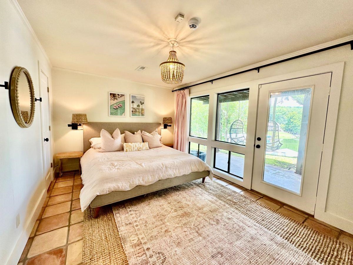 150 Turley Lane Counce, TN 38326 - Photo 21 of 35 a bedroom with a large bed and a window