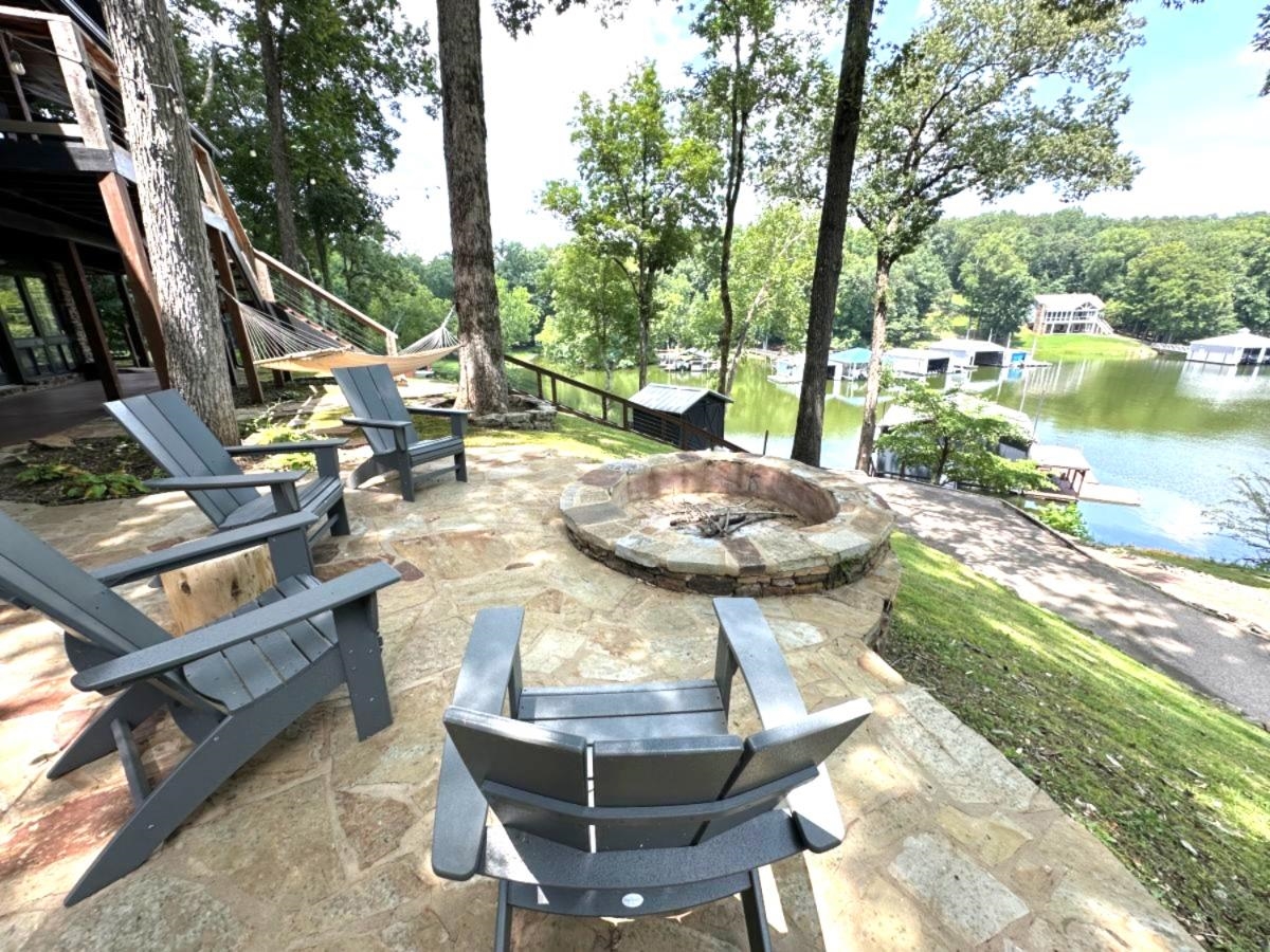 150 Turley Lane Counce, TN 38326 - Photo 26 of 35 a view of a backyard with table and chairs potted plants and large tree