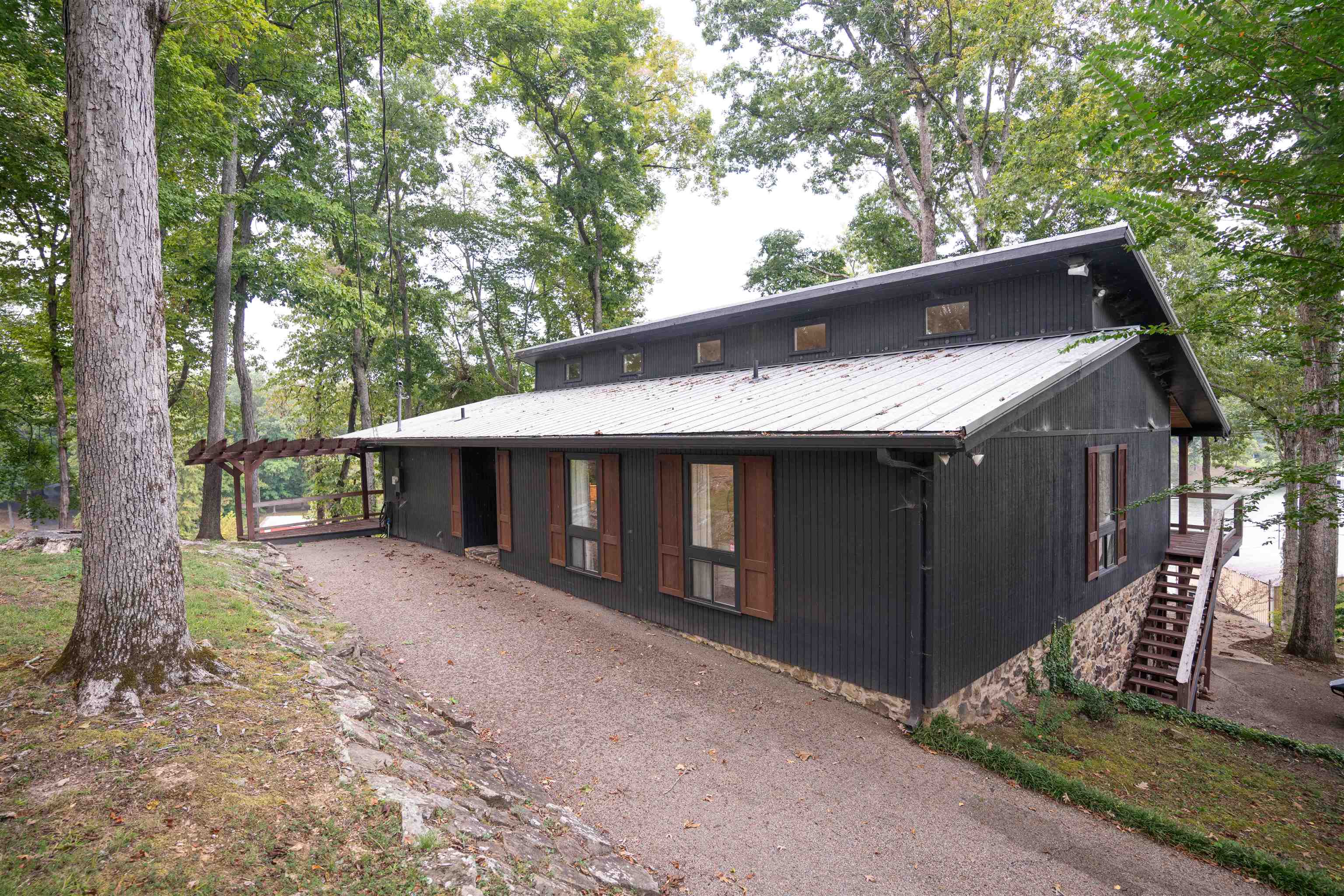 150 Turley Lane Counce, TN 38326 - Photo 28 of 35 a view of a house with a large tree and wooden fence