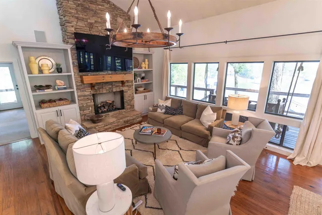 a kitchen with stainless steel appliances a stove a sink and cabinets
