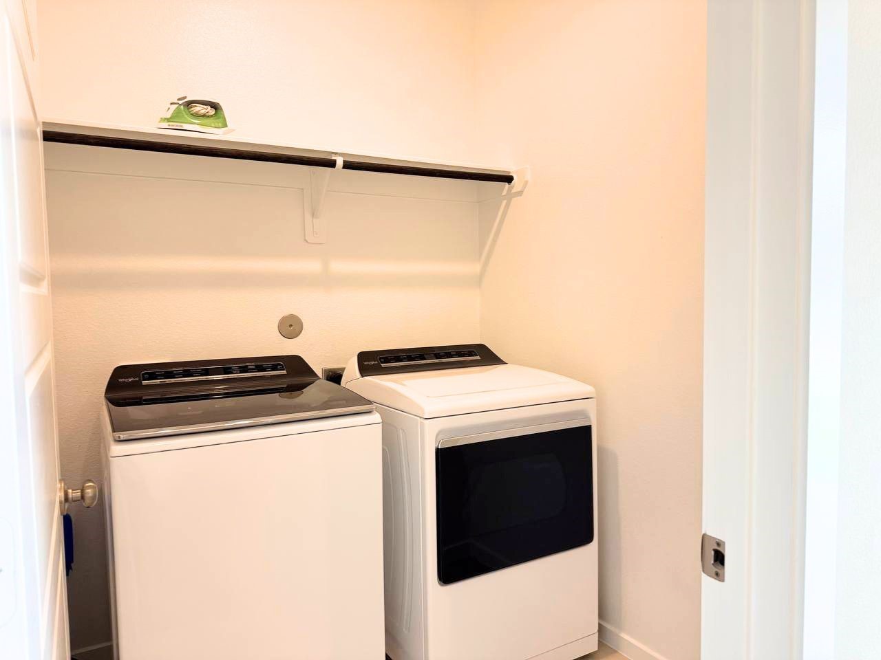 16246 Parish Pointe Court Conroe, TX 77302 - Photo 28 of 32 a utility room with dryer and washer