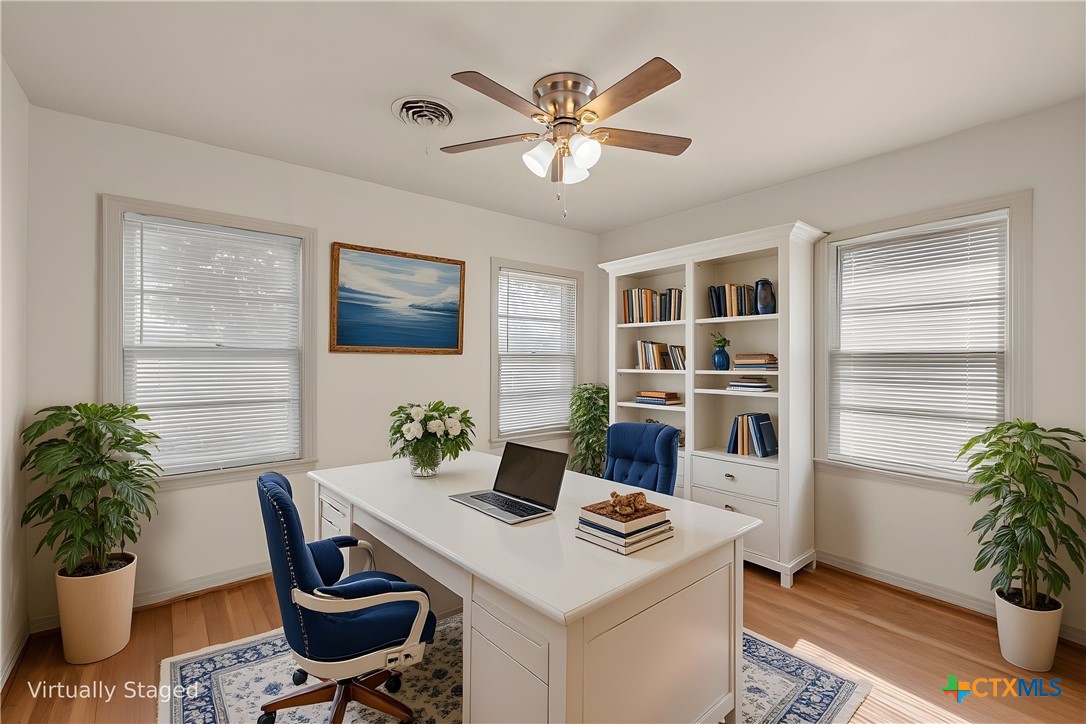 1612 South 49th Street Temple, TX 76504 - Photo 16 of 24 a workspace with furniture and a potted plant