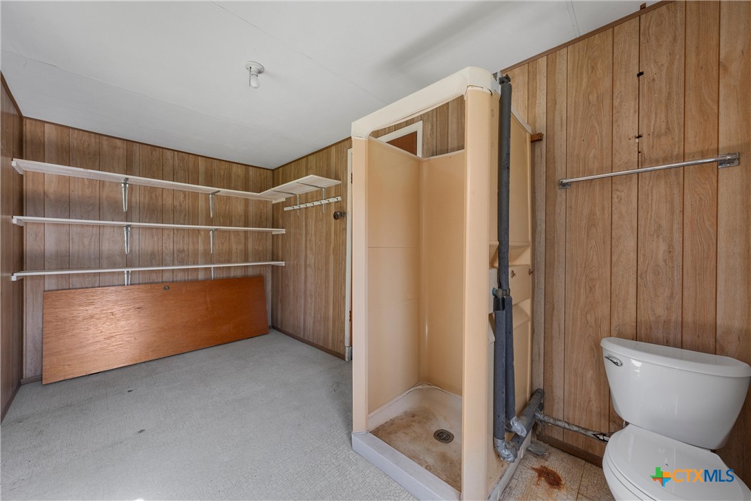 1612 South 49th Street Temple, TX 76504 - Photo 18 of 24 a bathroom with a shower and a toilet