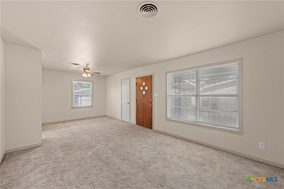 1612 South 49th Street Temple, TX 76504 - Photo 4 of 24 an empty room with windows and closet