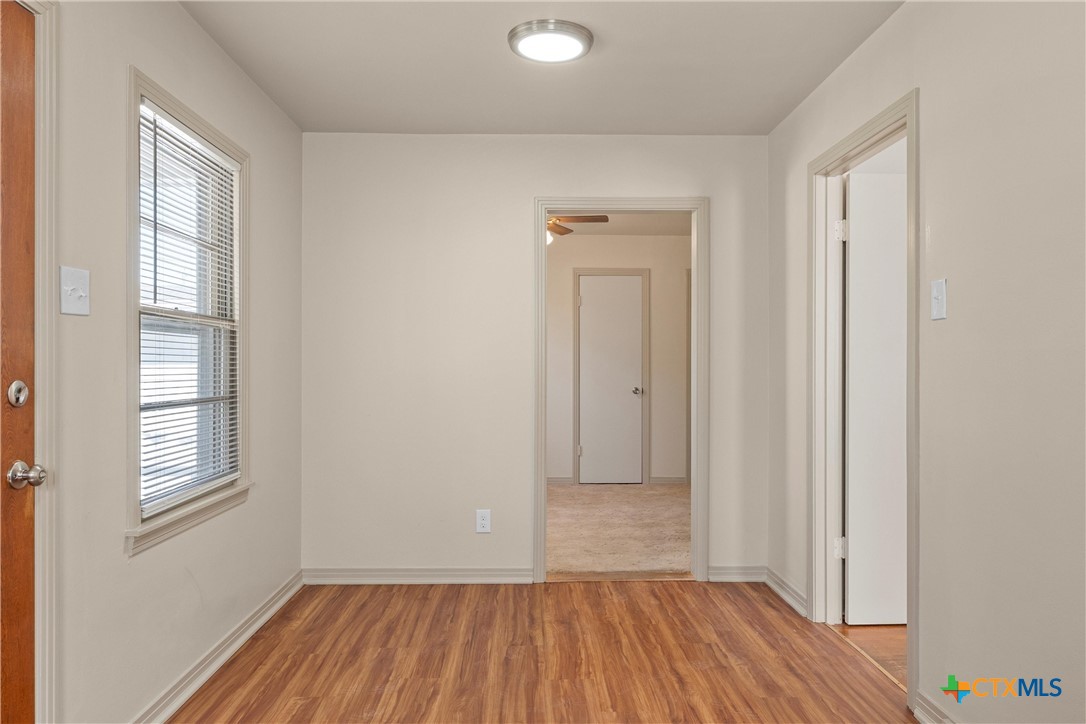 1612 South 49th Street Temple, TX 76504 - Photo 10 of 24 a view of a room with wooden floor and window