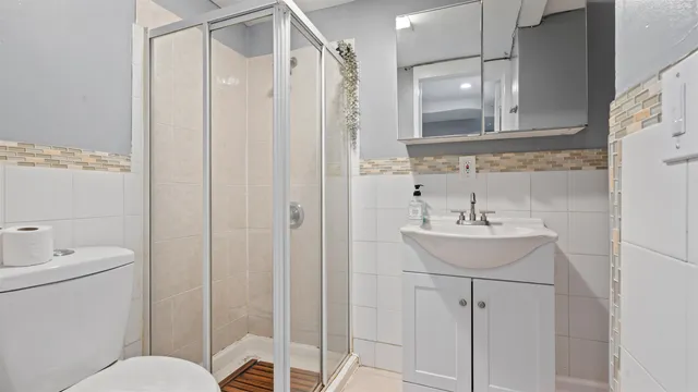 a bedroom with a bed and a mirror