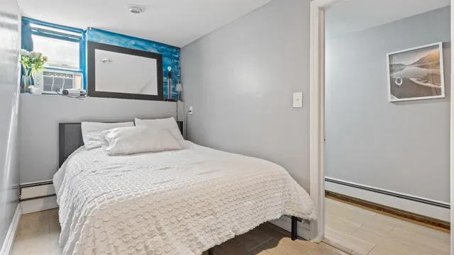 a view of a house with a yard and potted plants
