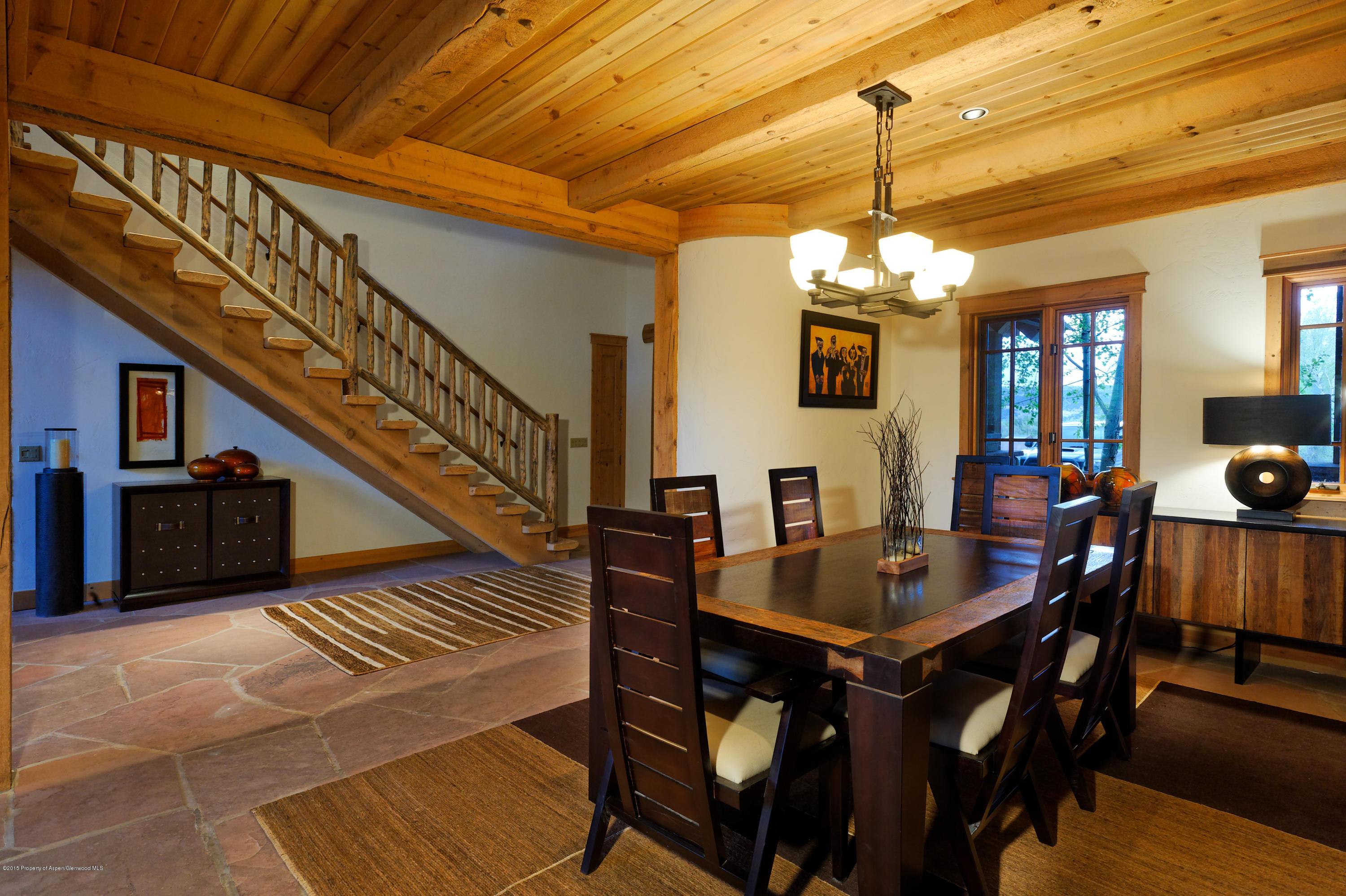 298 Red Rock Road Basalt, CO 81621 - Photo 16 of 30 a view of a dining room with furniture window and wooden floor