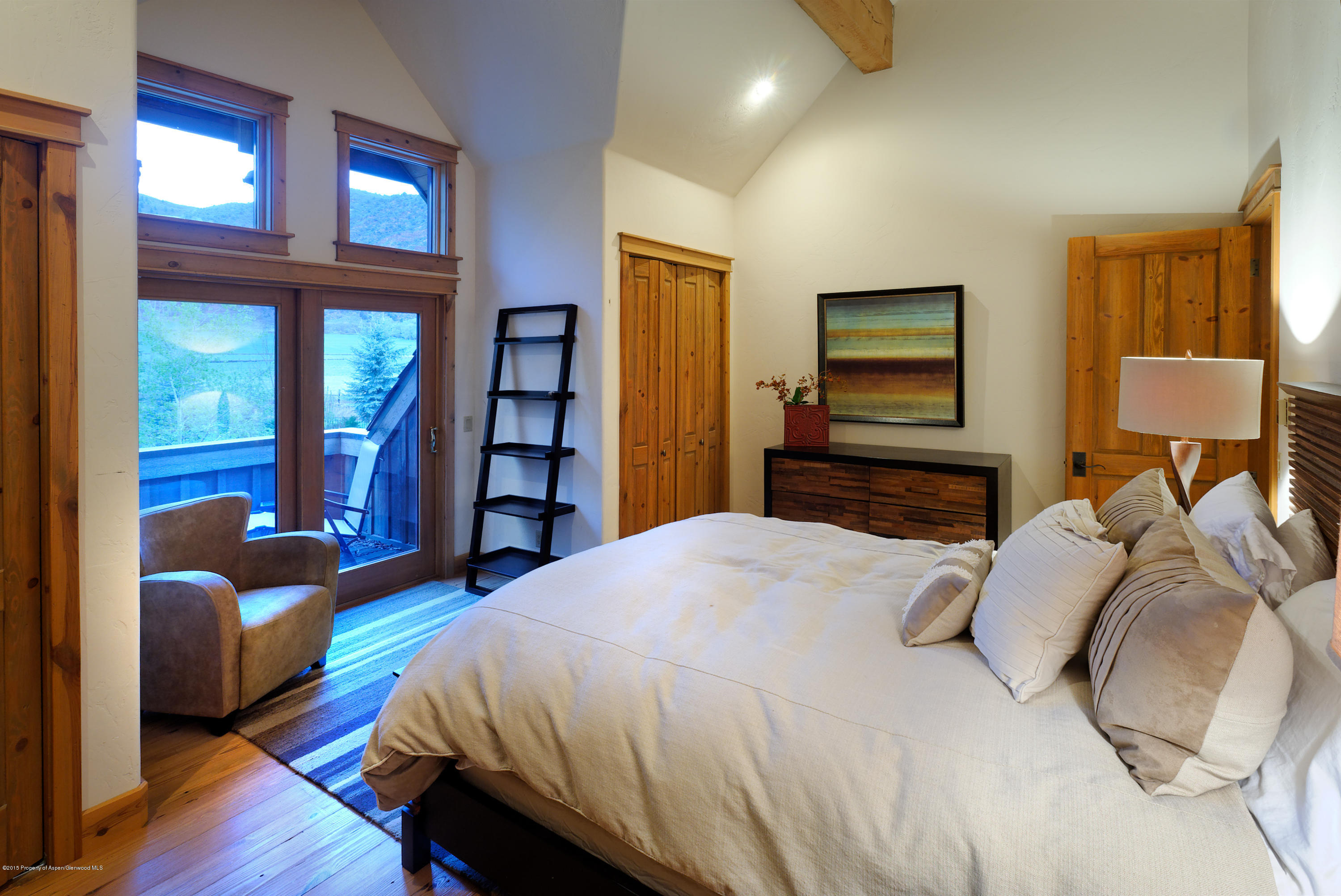 298 Red Rock Road Basalt, CO 81621 - Photo 20 of 30 a bedroom with a bed couch and a window
