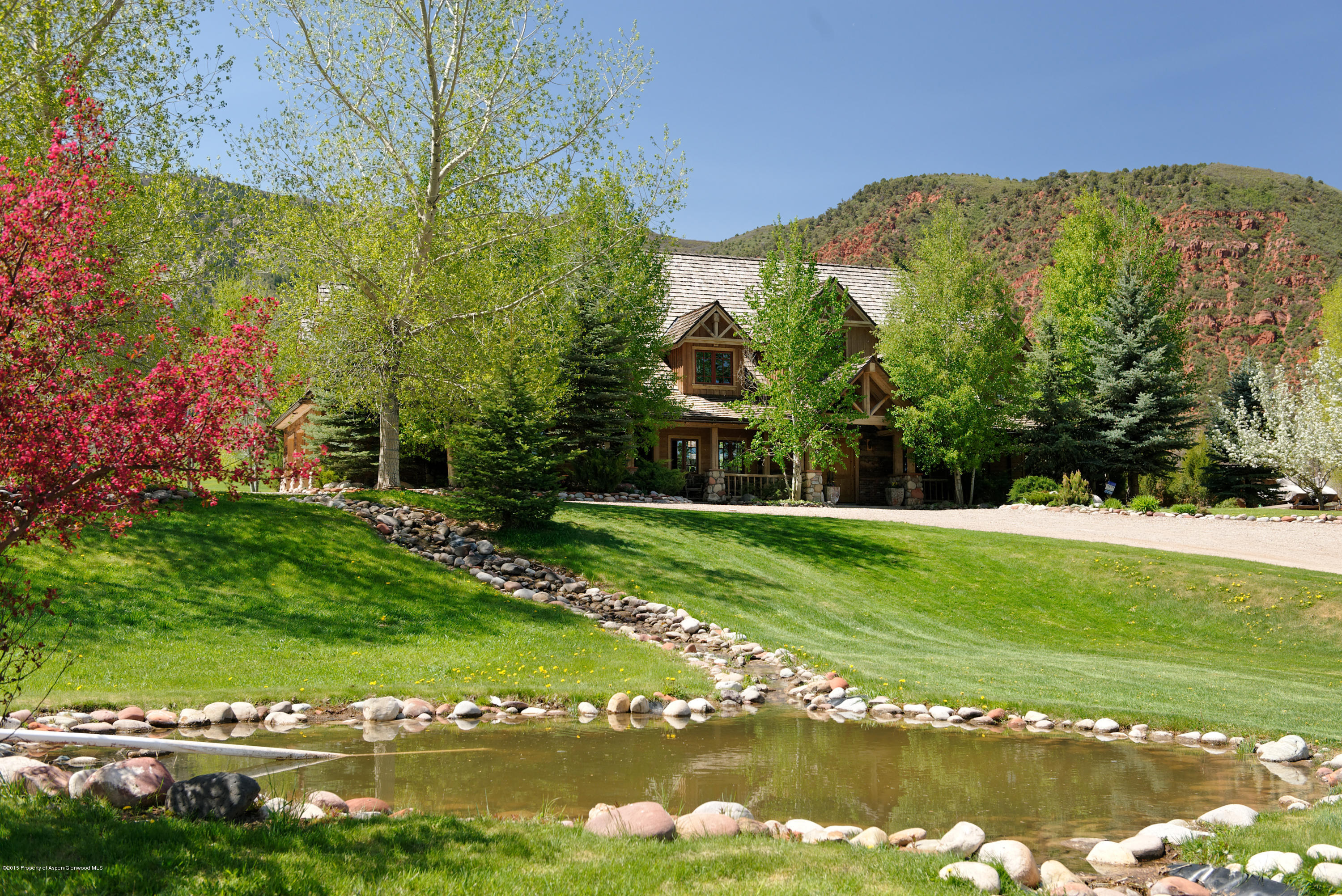 298 Red Rock Road Basalt, CO 81621 - Photo 2 of 30 a view of a lake with a houses in the background