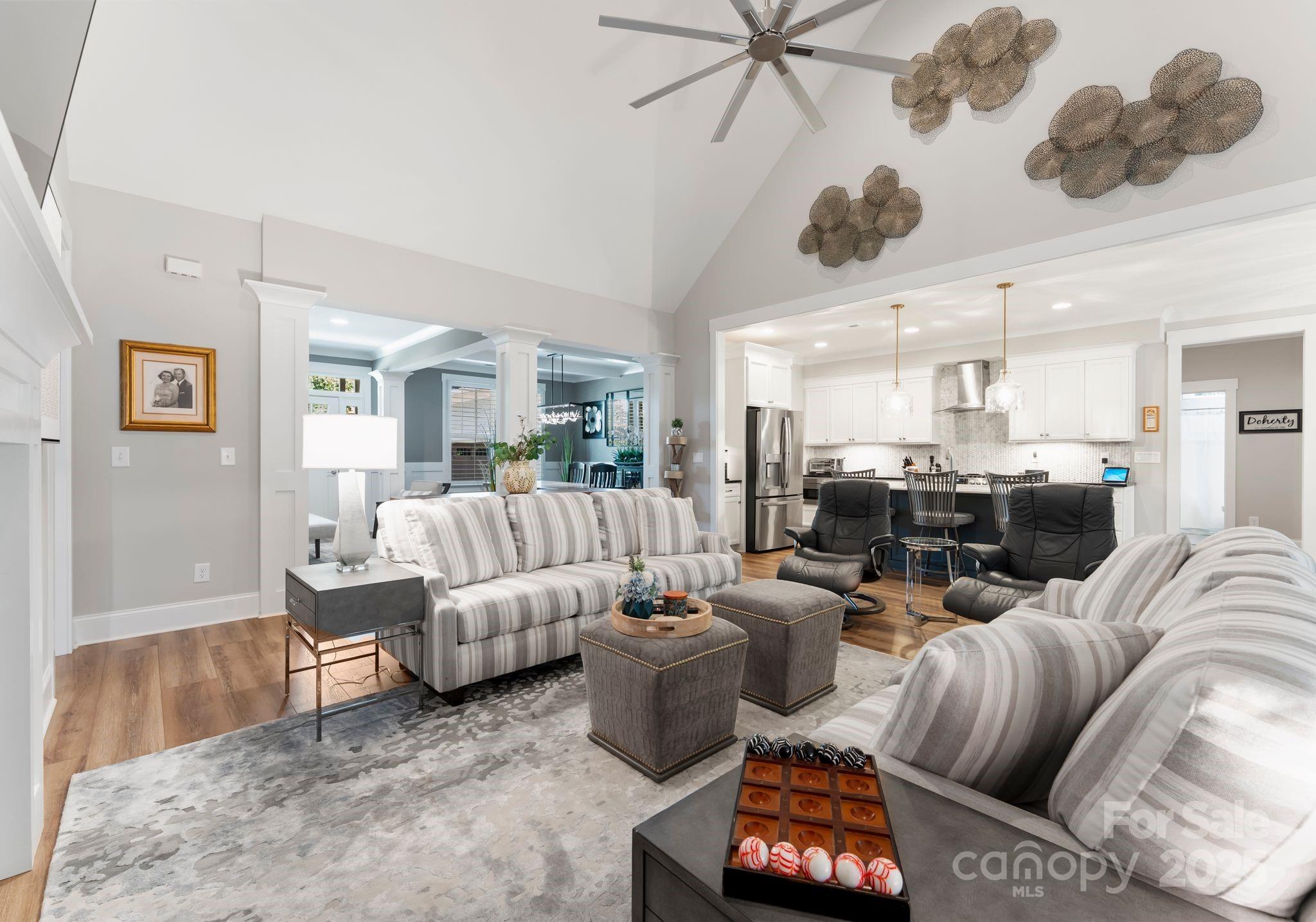 4275 Silver Eagle Cove Denver, NC 28037 - Photo 11 of 48 a living room with furniture and a chandelier