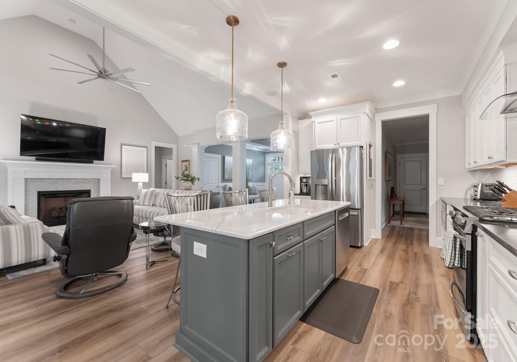 4275 Silver Eagle Cove Denver, NC 28037 - Photo 13 of 48 a open kitchen with stainless steel appliances granite countertop a stove and a refrigerator