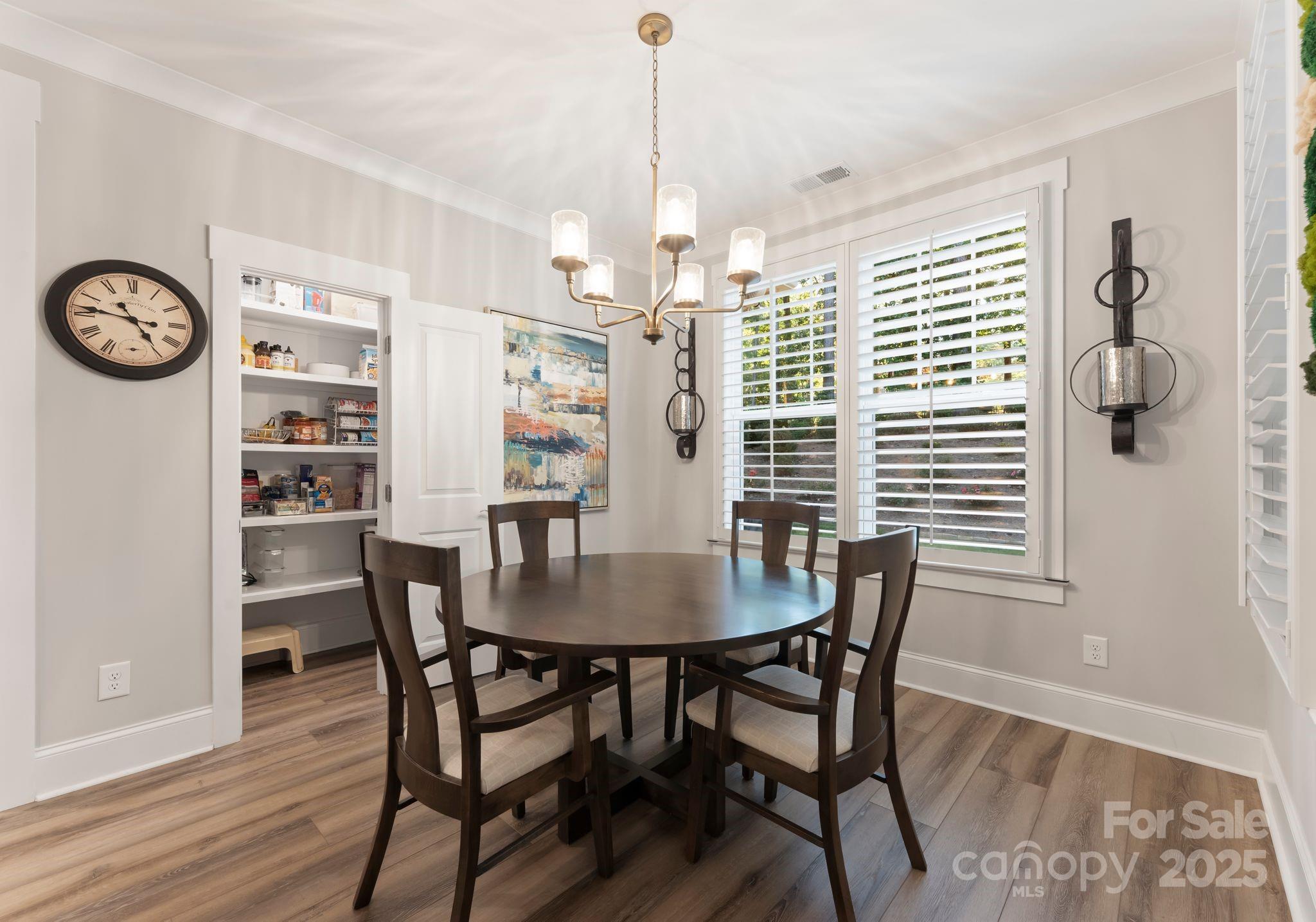 4275 Silver Eagle Cove Denver, NC 28037 - Photo 17 of 48 a view of a dining room with furniture window and wooden floor