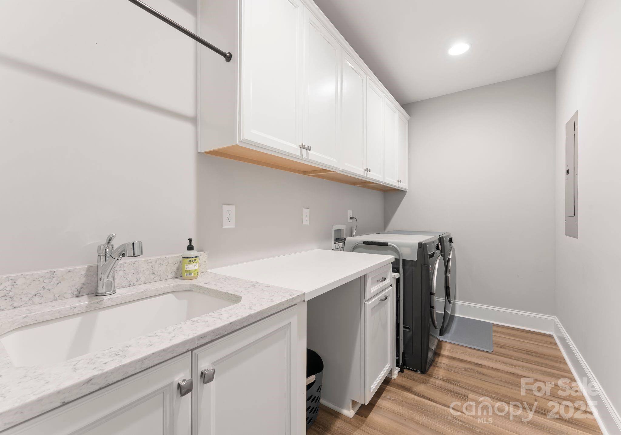 4275 Silver Eagle Cove Denver, NC 28037 - Photo 18 of 48 a kitchen with a sink a stove and cabinets