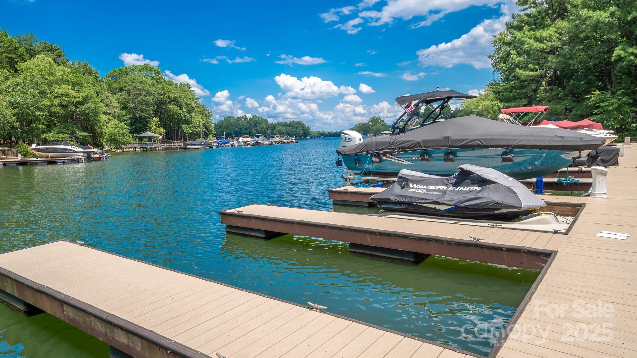 4275 Silver Eagle Cove Denver, NC 28037 - Photo 2 of 48 a view of a wooden deck with lake view