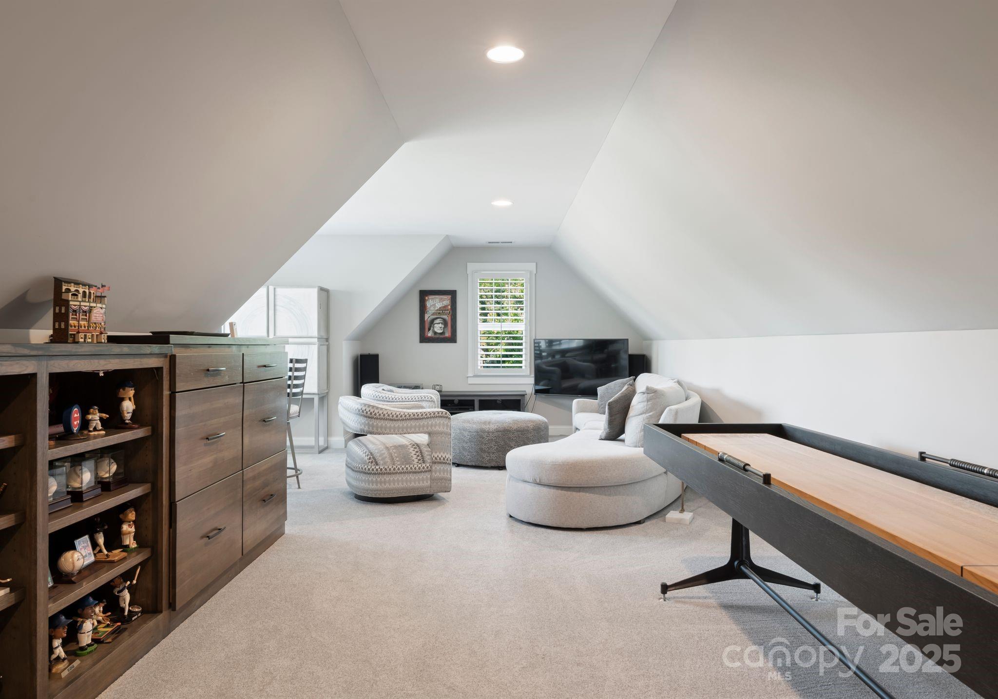 4275 Silver Eagle Cove Denver, NC 28037 - Photo 24 of 48 a living room with furniture and a book shelf