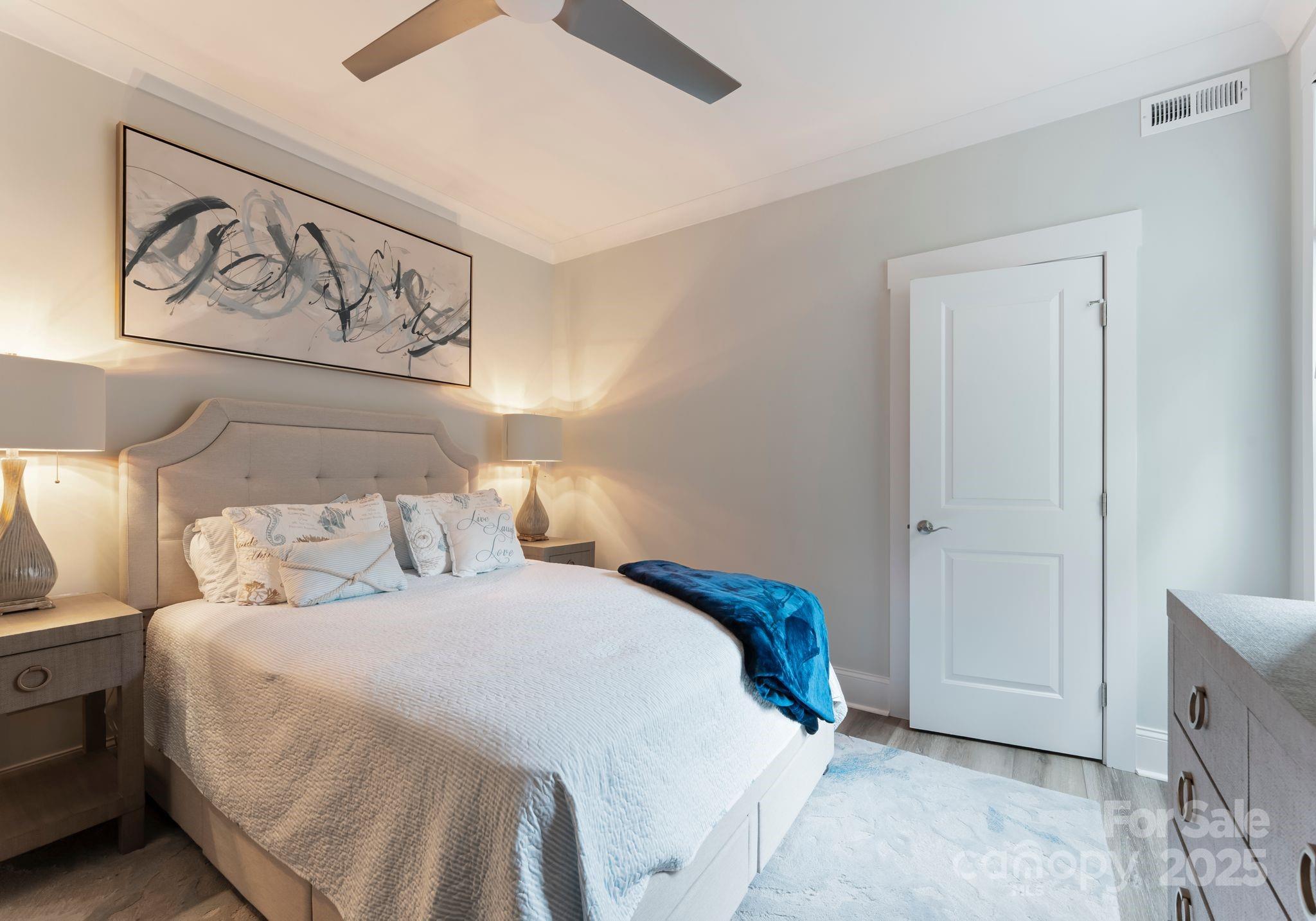 4275 Silver Eagle Cove Denver, NC 28037 - Photo 27 of 48 a bedroom with a bed and painting on the wall