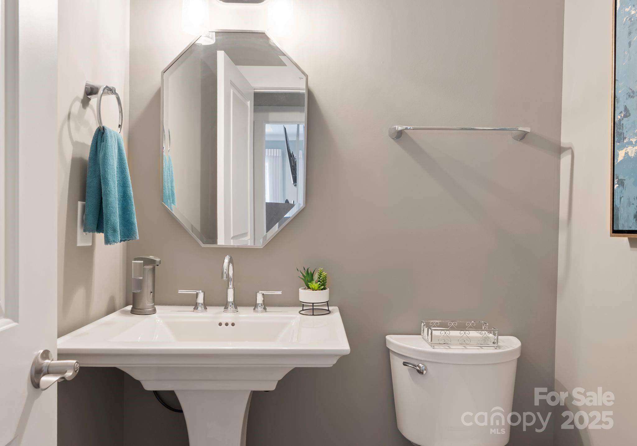 4275 Silver Eagle Cove Denver, NC 28037 - Photo 28 of 48 a bathroom with a toilet sink and mirror