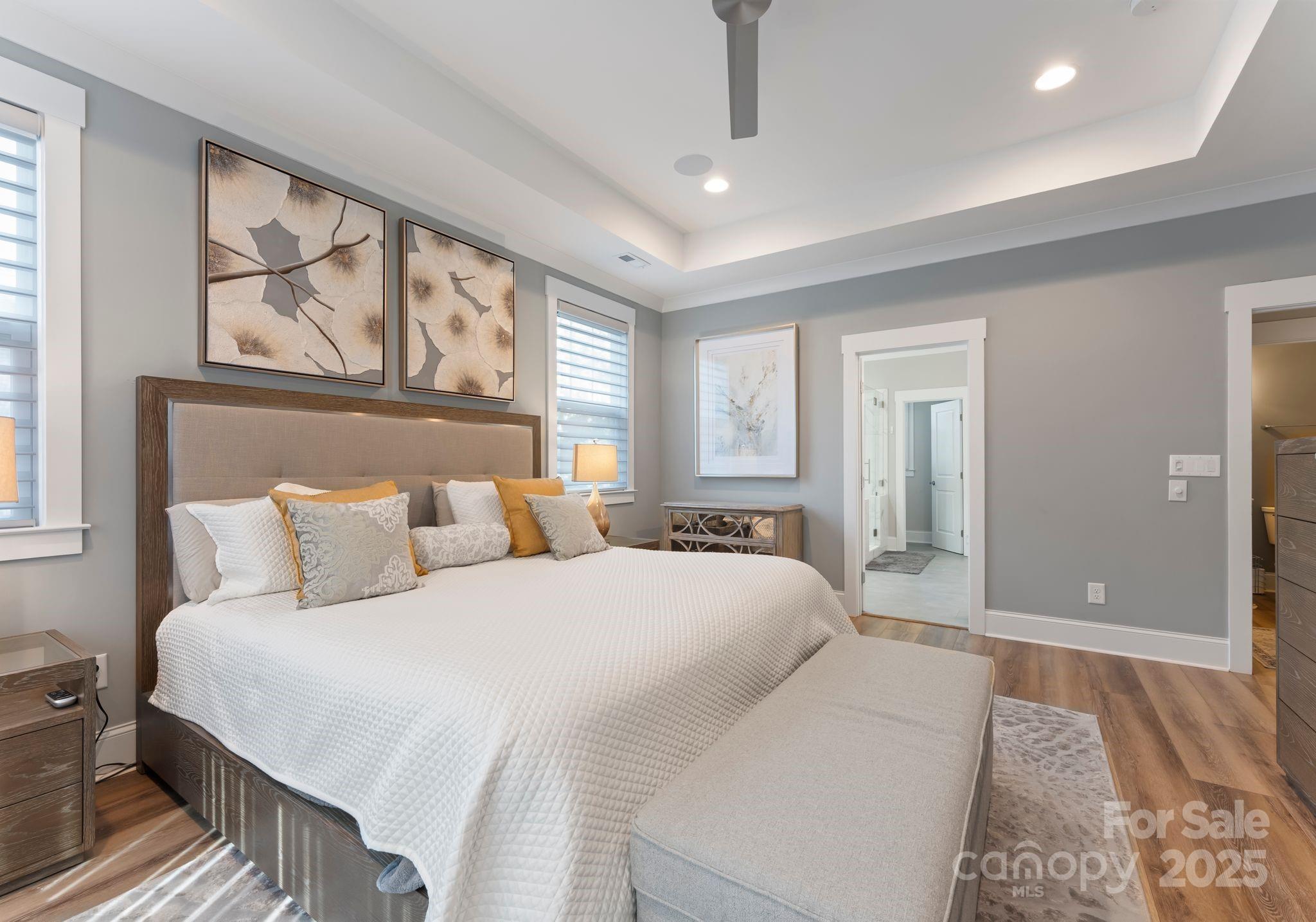 4275 Silver Eagle Cove Denver, NC 28037 - Photo 30 of 48 a bedroom with a large bed and a chandelier