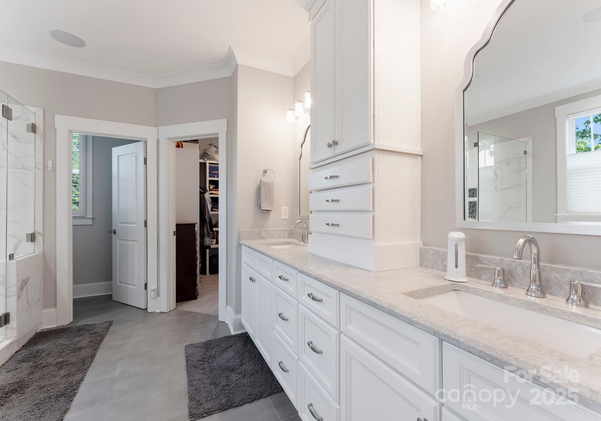 4275 Silver Eagle Cove Denver, NC 28037 - Photo 31 of 48 a spacious bathroom with a granite countertop sink and a mirror