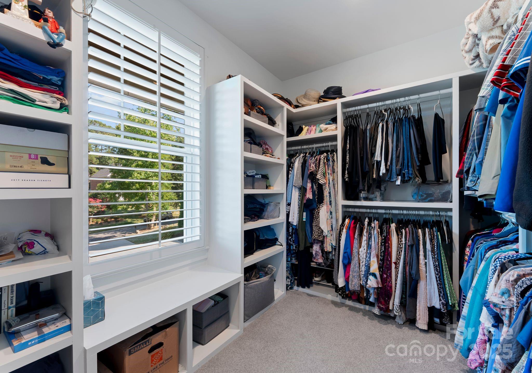 4275 Silver Eagle Cove Denver, NC 28037 - Photo 32 of 48 a view of walk in closet with clothes and shoes