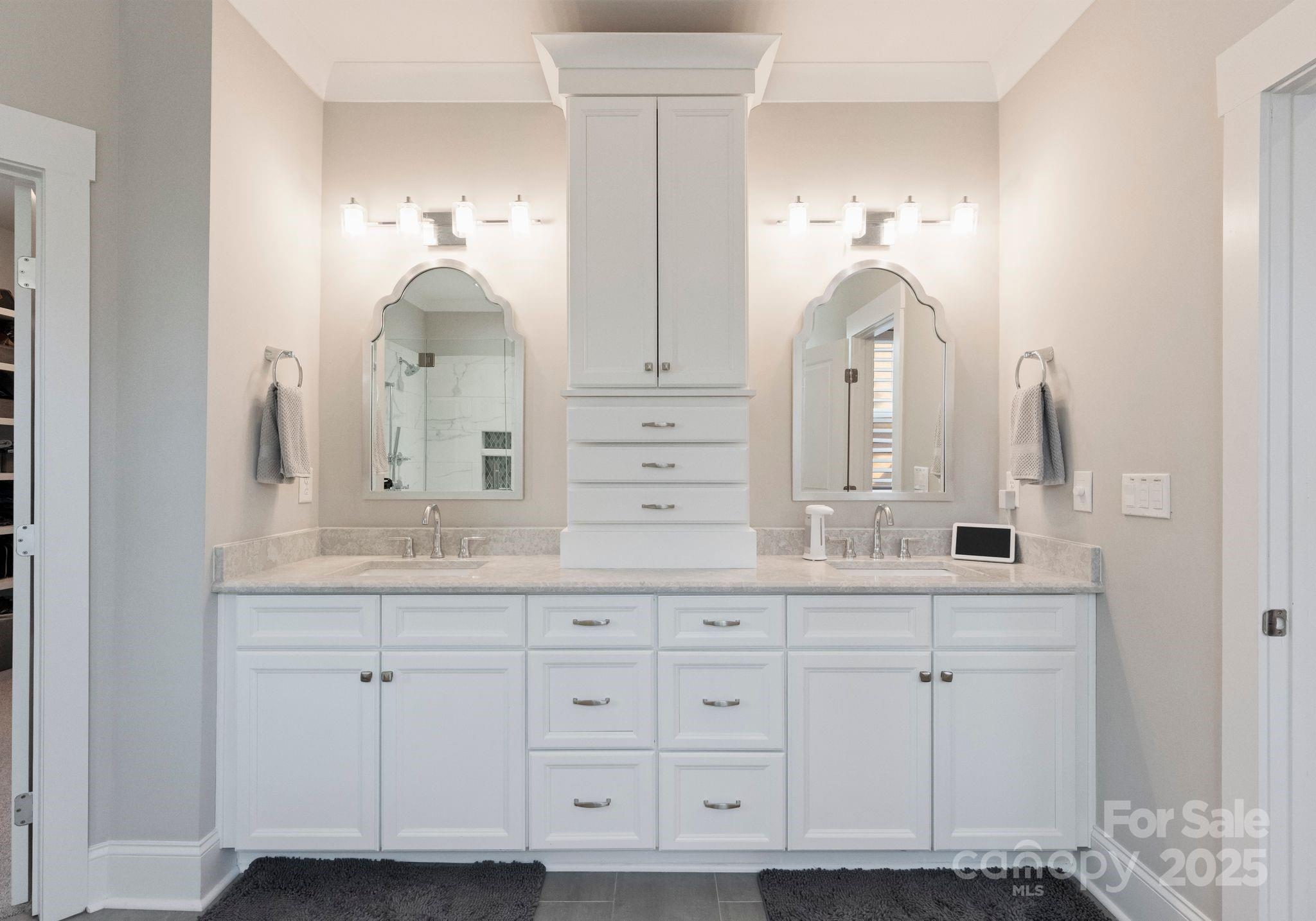 4275 Silver Eagle Cove Denver, NC 28037 - Photo 34 of 48 a bathroom with white cabinets and sink