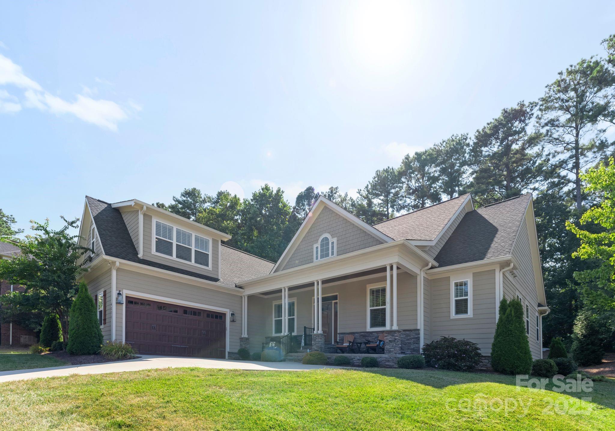 4275 Silver Eagle Cove Denver, NC 28037 - Photo 45 of 48 a front view of a house with a yard and garage