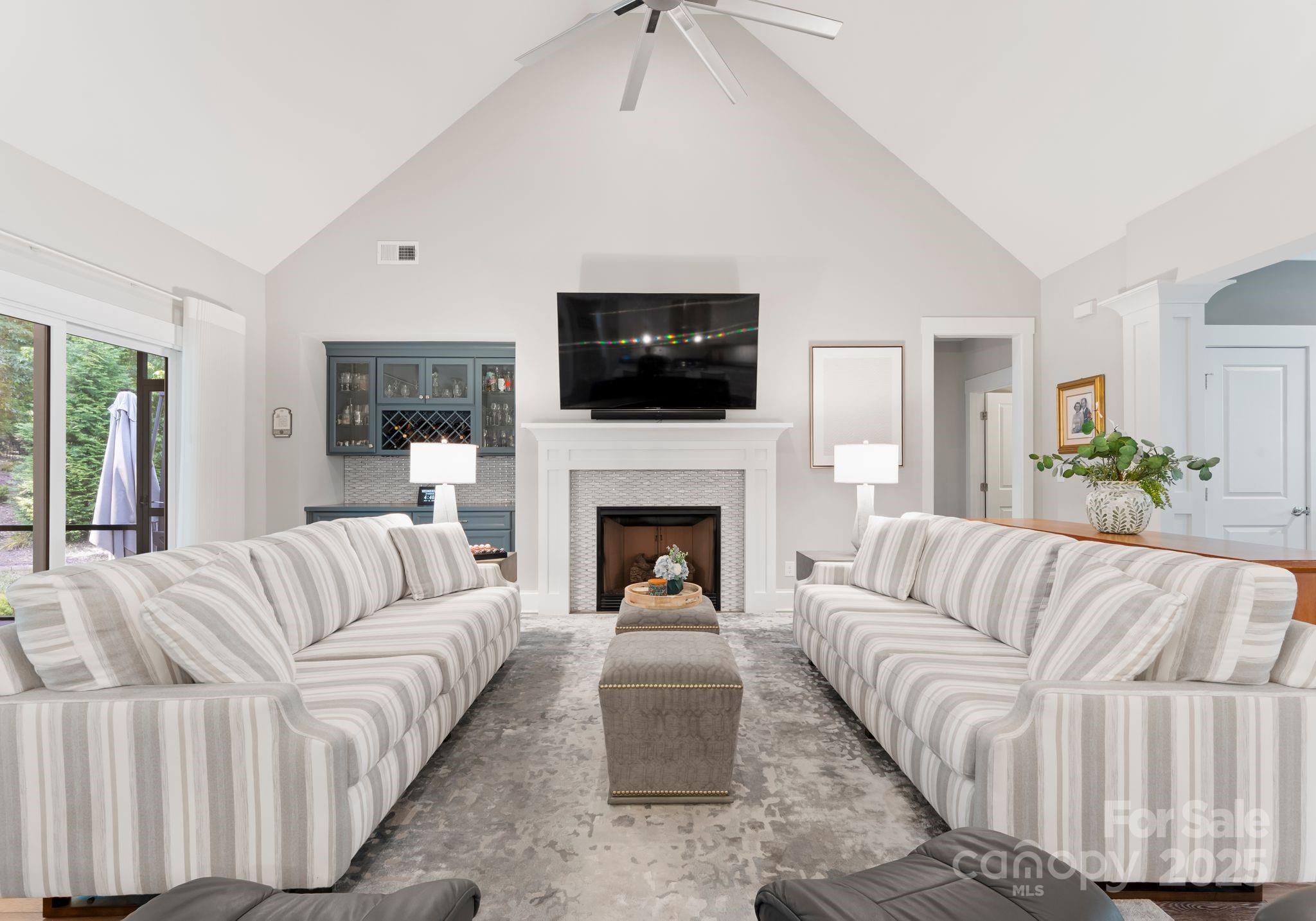 4275 Silver Eagle Cove Denver, NC 28037 - Photo 10 of 48 a living room with furniture a flat screen tv and a fireplace