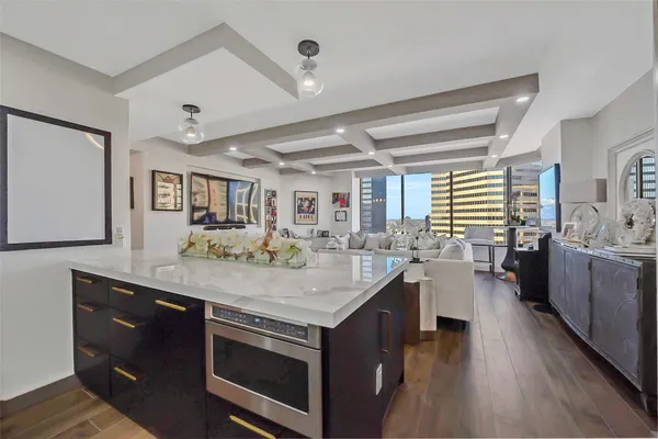 a kitchen with a sink cabinets and appliances