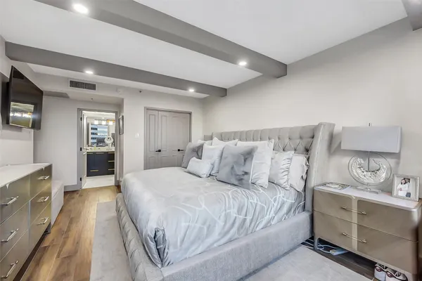 a bathroom with a sink shower and a mirror
