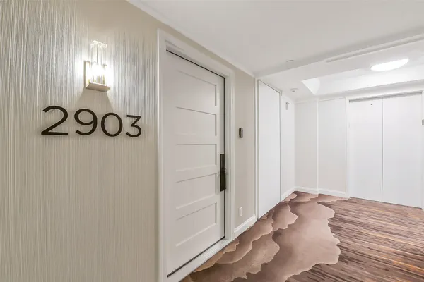 a view of a livingroom with wooden floor