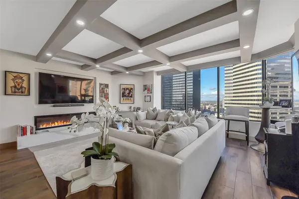 a kitchen with kitchen island granite countertop a sink cabinets and stainless steel appliances