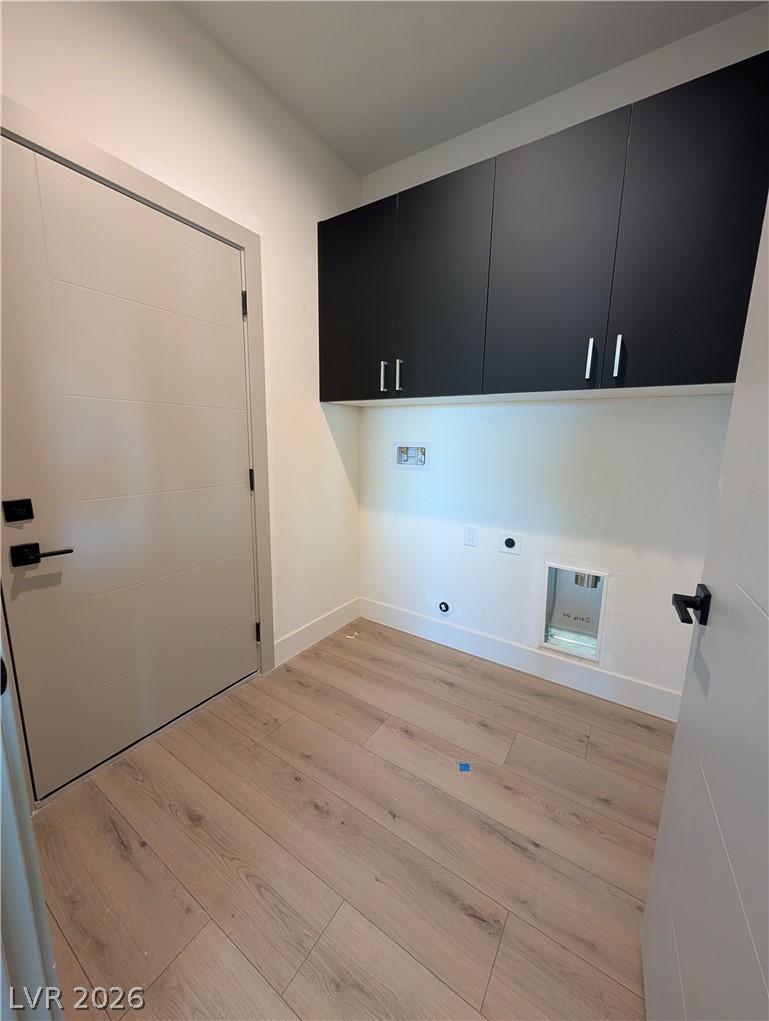 4670 Medicine Man Road Pahrump, NV 89048 - Photo 26 of 36 Ample cabinetry and durable flooring create a functional laundry space.